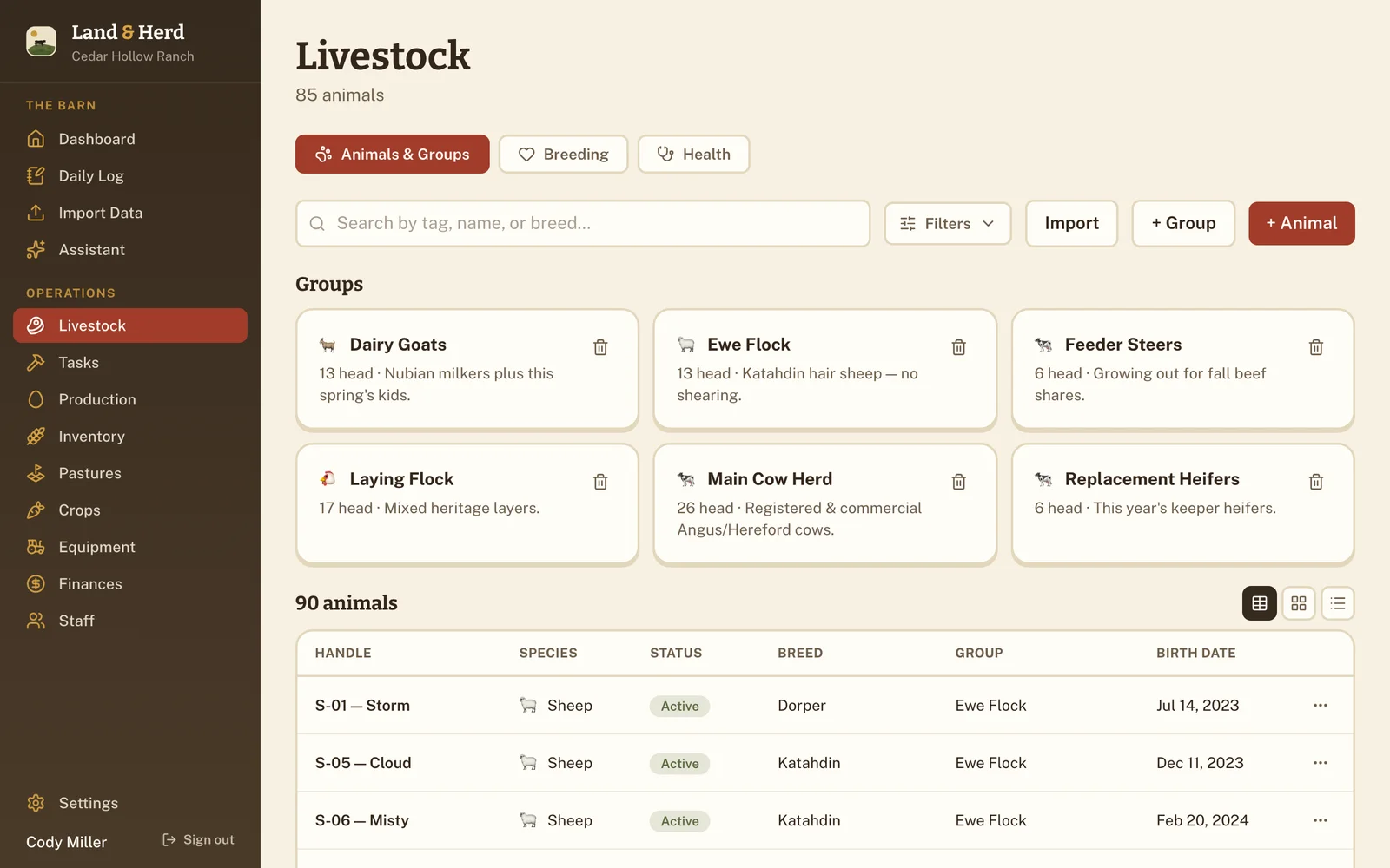 Livestock page with herd cards for the Main Cow Herd, Replacement Heifers, Dairy Goats, and Ewe Flock, above a searchable animal table.